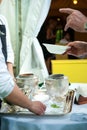 Waiters serve ice cream during a party