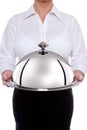 Waitess serving a silver dome or cloche