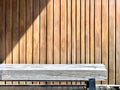 waiting area solid geometric texture wood bench with steel leg on stripe wood floor on vertical random size wood stripe background
