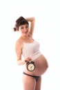 Waiting for the baby, bright funny pregnant woman with clock,