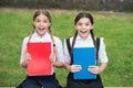 Waiting for the exam results. teen schoolgirls doing homework. Children using copybooks to study. Education and distance Royalty Free Stock Photo