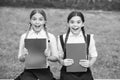 Waiting for the exam results. teen schoolgirls doing homework. Children using copybooks to study. Education and distance Royalty Free Stock Photo