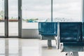 Waiting hall in airport with blue seats Royalty Free Stock Photo