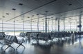 Waiting hall in the airport with empty arm-chairs. Royalty Free Stock Photo