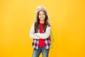 Waiting for lesson. cheerful child pupil. winter events at school. small girl wear earflap hat. winter school time Royalty Free Stock Photo