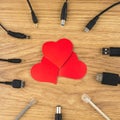 Waiting for love bonds: 3 red hearts and lots of different plugs and charger that can`t connect to it