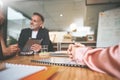 Waiting for the meeting to start. two businesspeople sitting together in the office and having a discussion while using Royalty Free Stock Photo