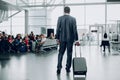 Man is holding his luggage at the airport Royalty Free Stock Photo