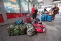 The waiting room of the MOSCOW Station. In the foreground are bags and hand luggage. In the back are the waiting trains,