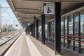 Waiting room sign on an empty railway station platform