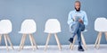 Waiting room, tablet and black man sitting at job opportunity, career application or Human Resources interview