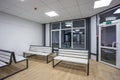 waiting room with wooden benches at a train station Royalty Free Stock Photo