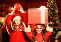 Waiting for Santa claus. Be Jolly and make good cheer for Christmas comes but once a year. Cute girls sisters friends Royalty Free Stock Photo