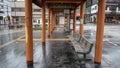 Waiting seat at empty bus stop with roof