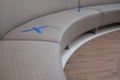 Waiting sofa with symbol on seat for the social distancing