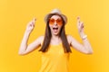 Waiting for special moment. Portrait of smiling happy woman in orange glasses keeping fingers crossed. Making wish. Copy Royalty Free Stock Photo