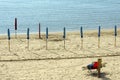 Waiting the summer - closed beach umbrellas