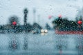 Waiting at a traffic junction for the green light during a rainy day; Royalty Free Stock Photo