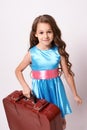 Waiting for trip. Little cute girl. Large suitcase Royalty Free Stock Photo