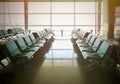 Waiting zone area with rows of green chairs for passengers Royalty Free Stock Photo