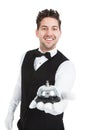 Waitperson Holding Service Bell Royalty Free Stock Photo