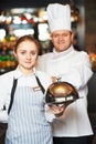 Waitres and chef in restaurant