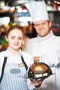 Waitres and chef in restaurant