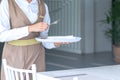 Waitress against empty tableware, table setting. close up Royalty Free Stock Photo