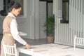 Waitress asian against empty tableware, table setting Royalty Free Stock Photo