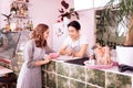 Waitress and barman having conversation before opening bar