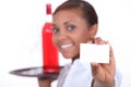 Waitress with a bottle Royalty Free Stock Photo