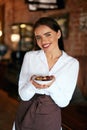 Waitress In Cafe. Woman With Chocolate Candies In Confectionery Royalty Free Stock Photo