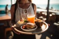 Waitress carrying a tray with tasty looking food in outdoor restauran. Generative AI