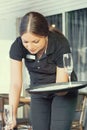 The waitress is carrying a wine glasses Royalty Free Stock Photo