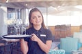 The waitress is carrying a wine glasses Royalty Free Stock Photo