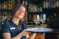 Waitress is carrying a wine glasses Royalty Free Stock Photo