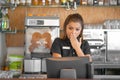 The waitress at the cash register Royalty Free Stock Photo