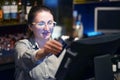 The waitress at the cash register Royalty Free Stock Photo