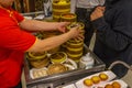 Waitress catering dimsum in bamboo steamer boxes in Chinese restaurant