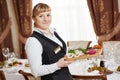 Waitress at catering work in a restaurant Royalty Free Stock Photo