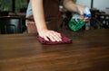 Waitress cleaning the table with spray disinfectant Royalty Free Stock Photo