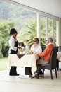 Waitress, coffee and senior couple in restaurant patio on romantic date together at table. Old man, woman and server