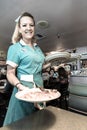 Waitress delivers breakfast at Peggy Sue's Americana Route 66 inspired diner in Yermo, California about eight miles outside of Bar