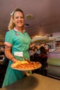 Waitress delivers breakfast at Peggy Sue's Americana Route 66 inspired diner in Yermo, California about eight miles outside of Bar