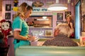 Waitress delivers breakfast at Peggy Sue's Americana Route 66 inspired diner in Yermo, California about eight miles outside of Bar