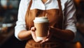 Waitress delivers steaming coffee in a paper cup at a cafe