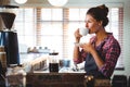 Waitress drinking a coffee Royalty Free Stock Photo