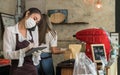Waitress with face mask take order for curbside pick up and takeout