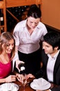 Waitress filling glasses with champagne Royalty Free Stock Photo