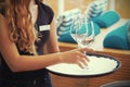 The waitress is carrying a wine glasses Royalty Free Stock Photo